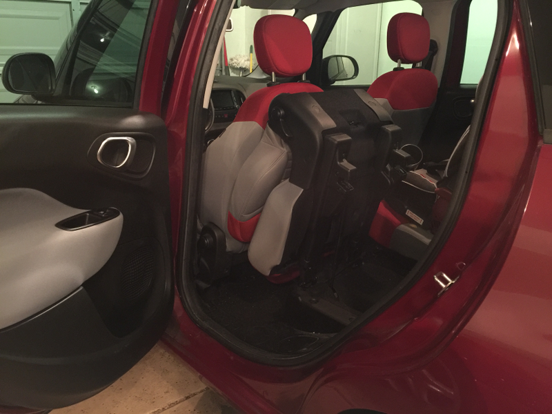 The rear seats even fold in an unusual manner. The seat back folds down, but the entire seat base tilts forward. A single gas strut holds the stowed seat in this position. Not sure this does anything amazing for cargo room, but I suppose it ekes out that last cubic foot or so.